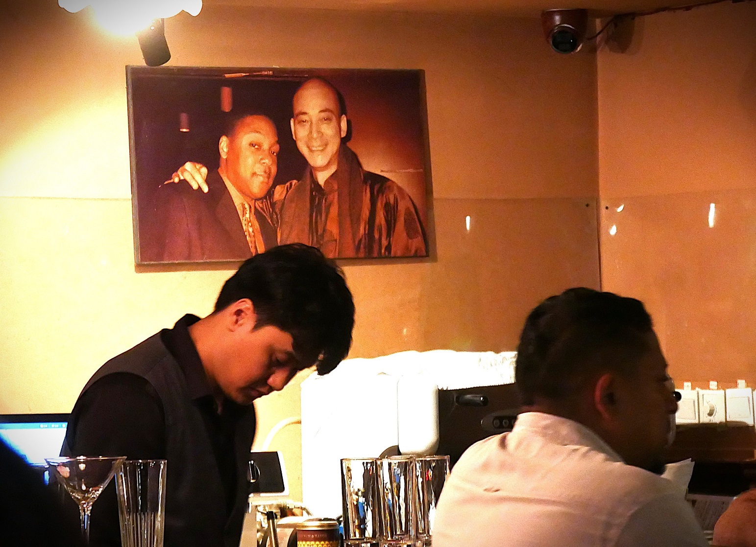 A photograph hanging in the House of Blues & Jazz shows owner Dongfu Lin with American trumpeter...