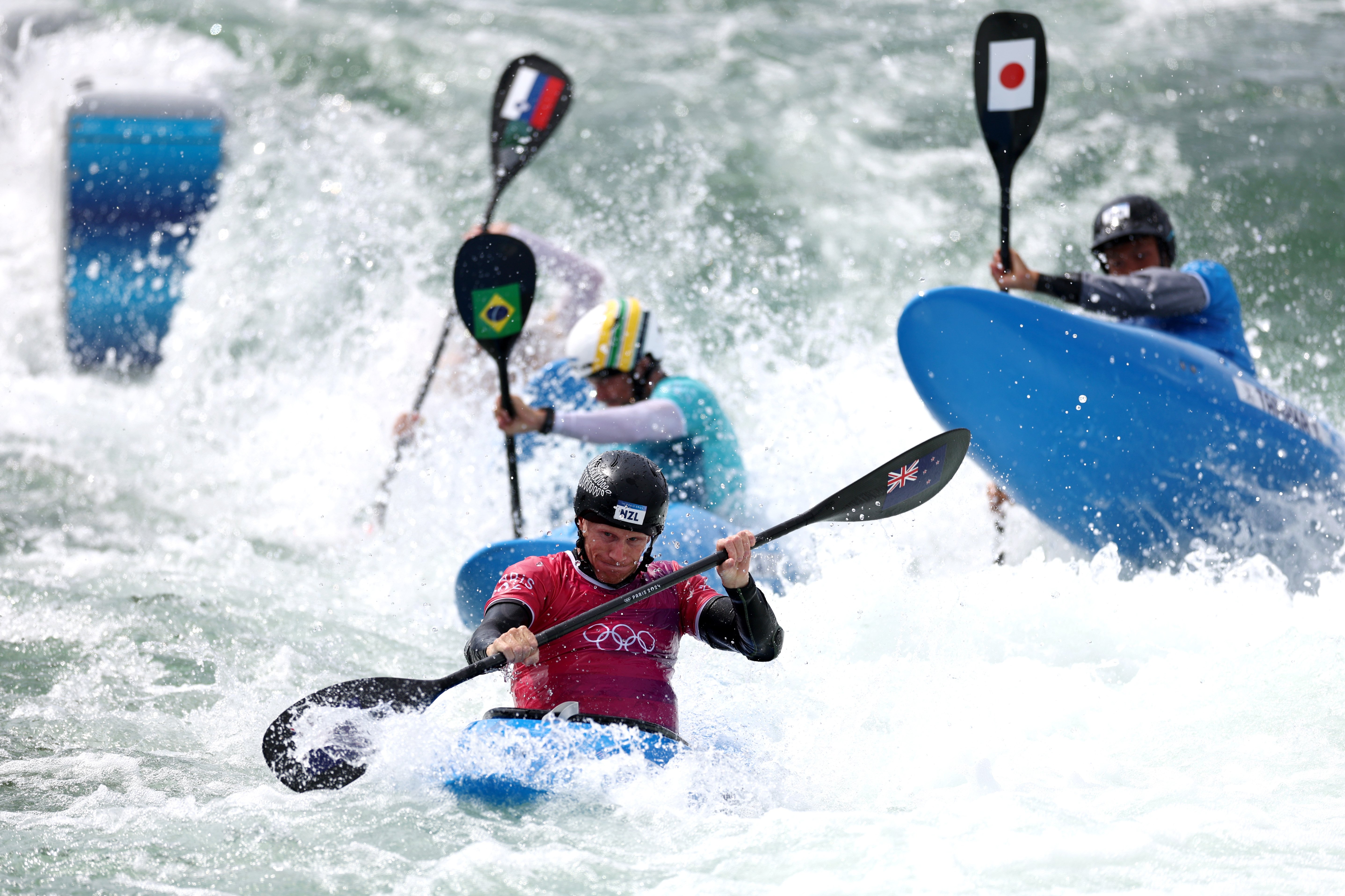 Finn Butcher charges to victory in his kayak cross heat in Paris yesterday. PHOTO: GETTY IMAGES