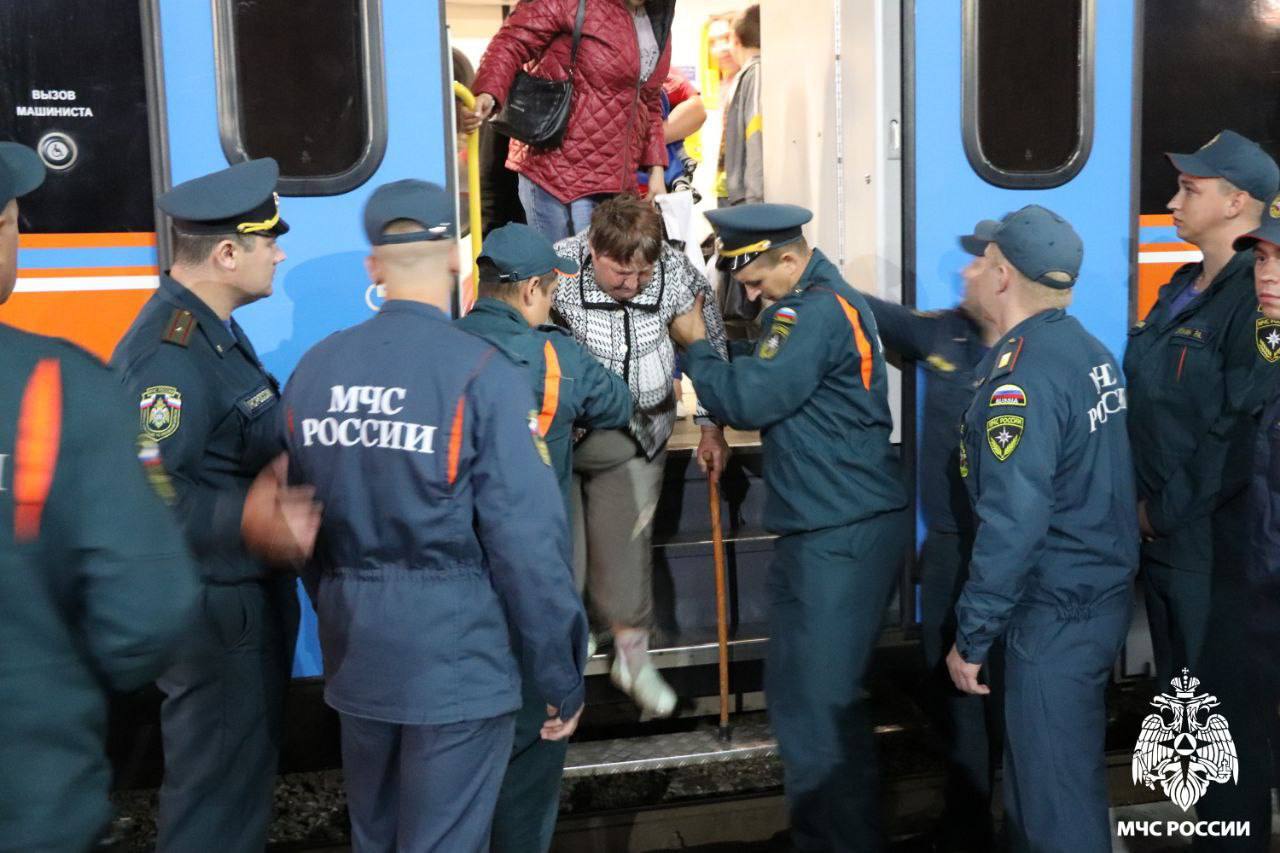 Evacuees from Russian border towns are helped from a train in the Russian city of Oryol. Photo:...