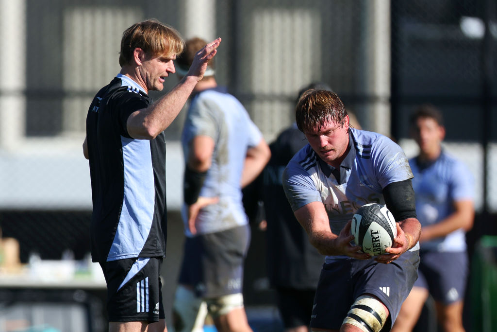 Coach Scott Robertson takes part in a drill with Ethan Blackadder during an All Blacks training...