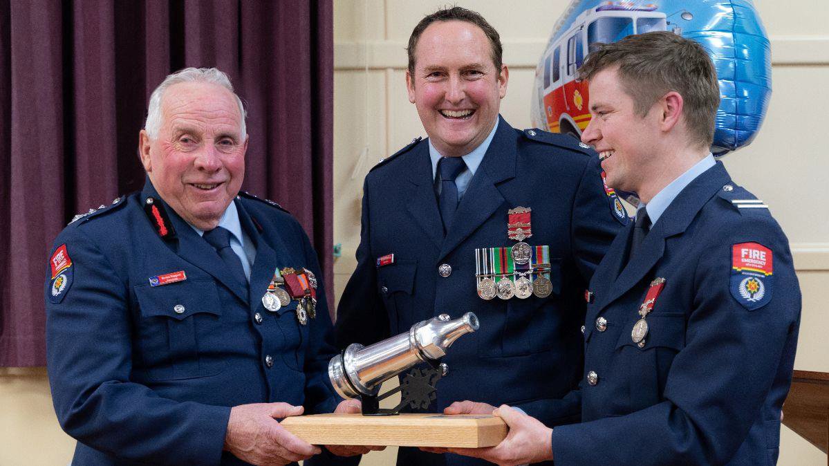 Weston Chief Fire Officer Bevan Koppert (left) receives his 50-year award, from Station Officer...