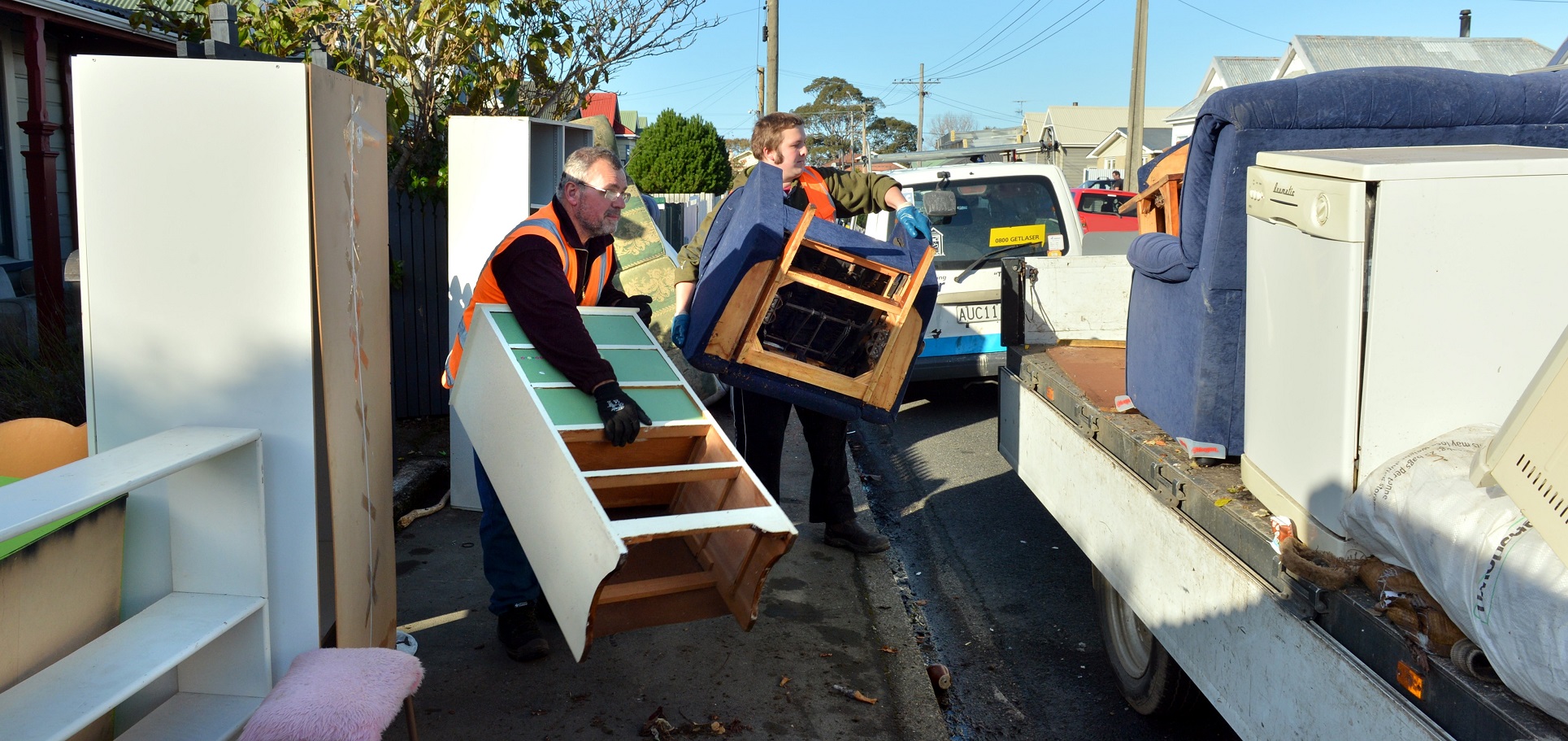 Flood-damaged furniture is removed from a Nelson St house following the 2015 South Dunedin flood....