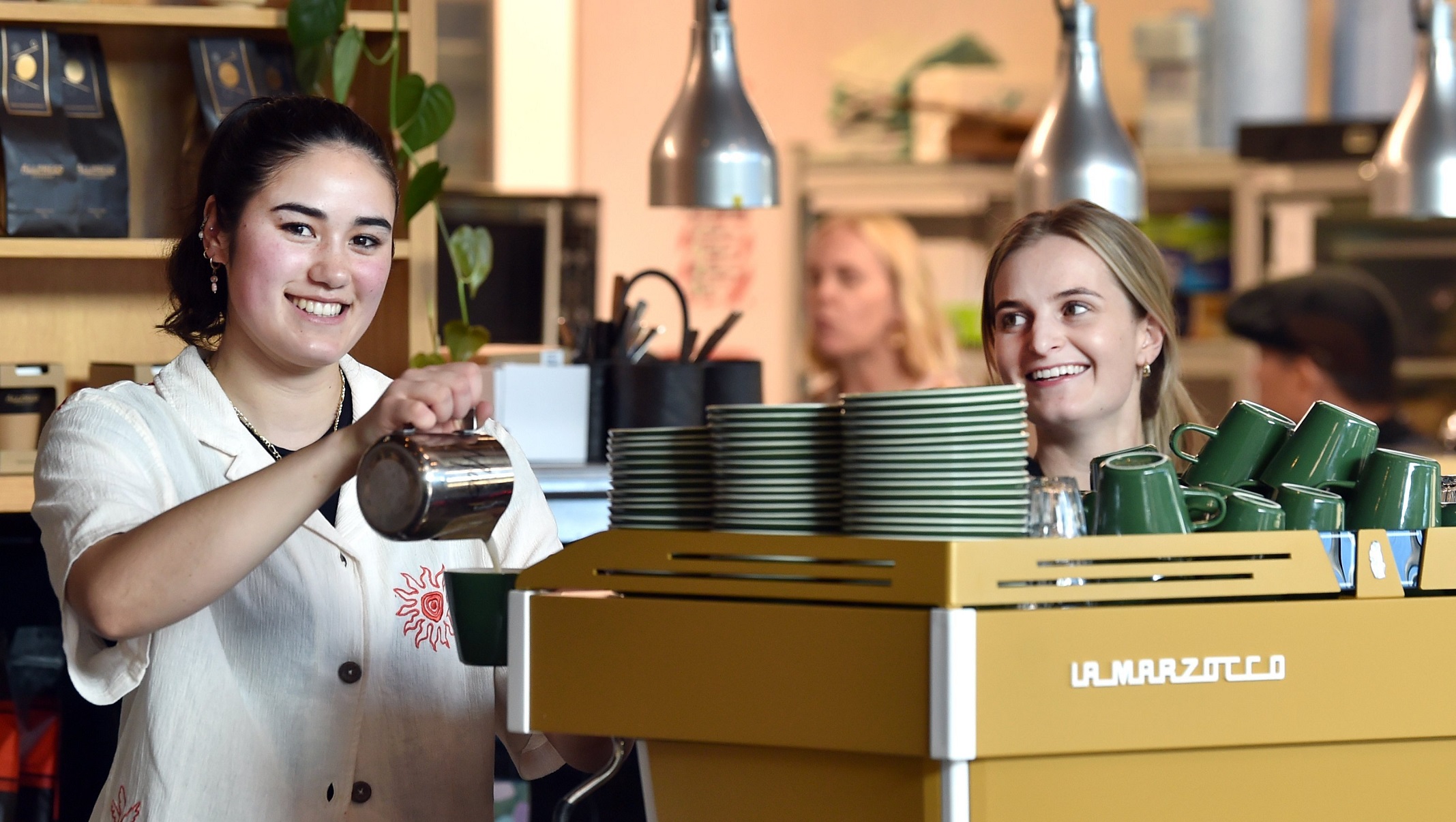 The Perc Plaza staff Didi Tamang (left) and Anna McIntyre, both 21, brew a coffee on The Perc...