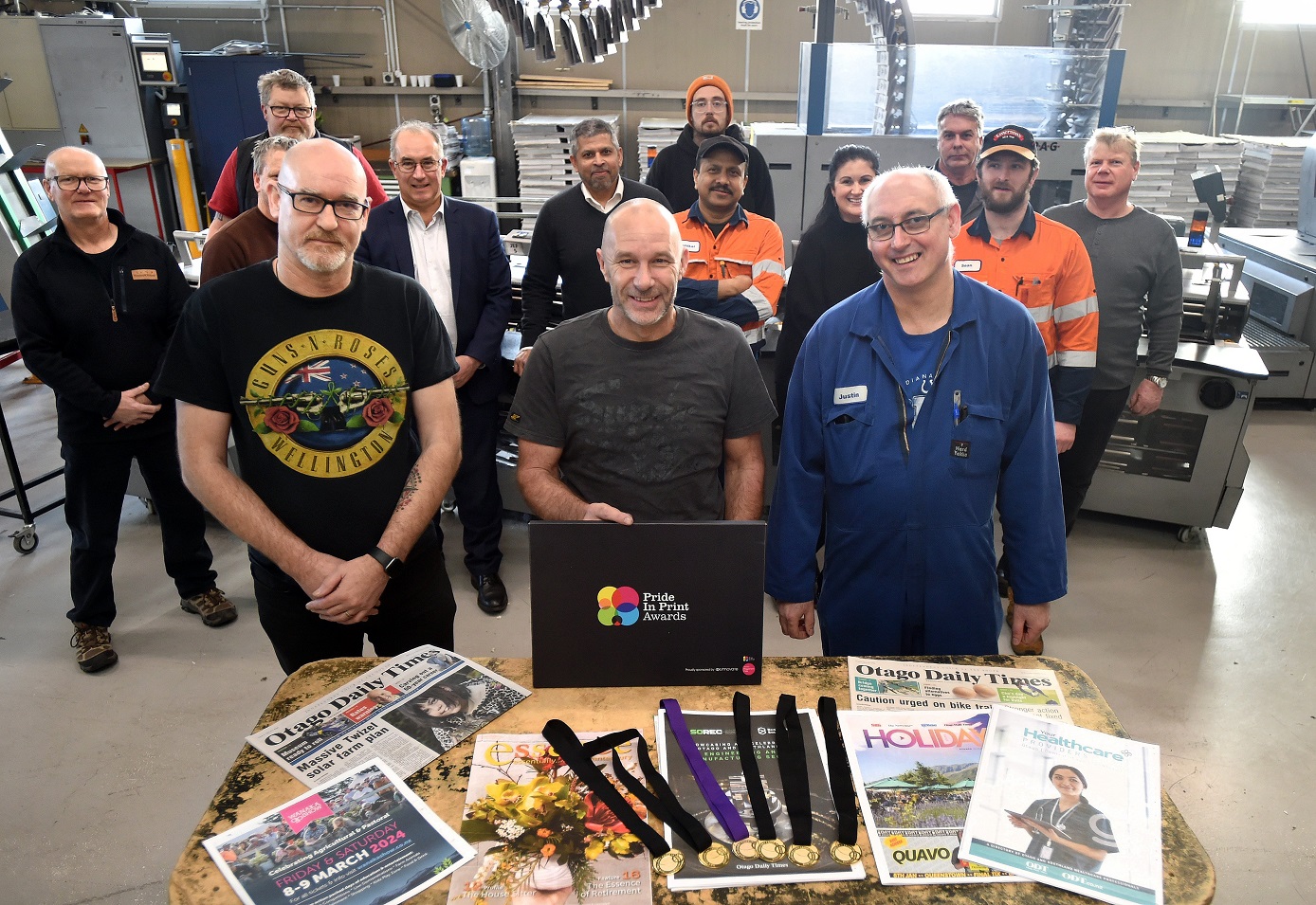 Allied Press printers (from left) Chris Ibbotson, Steve Taylor and Justin Aitken display the gold...