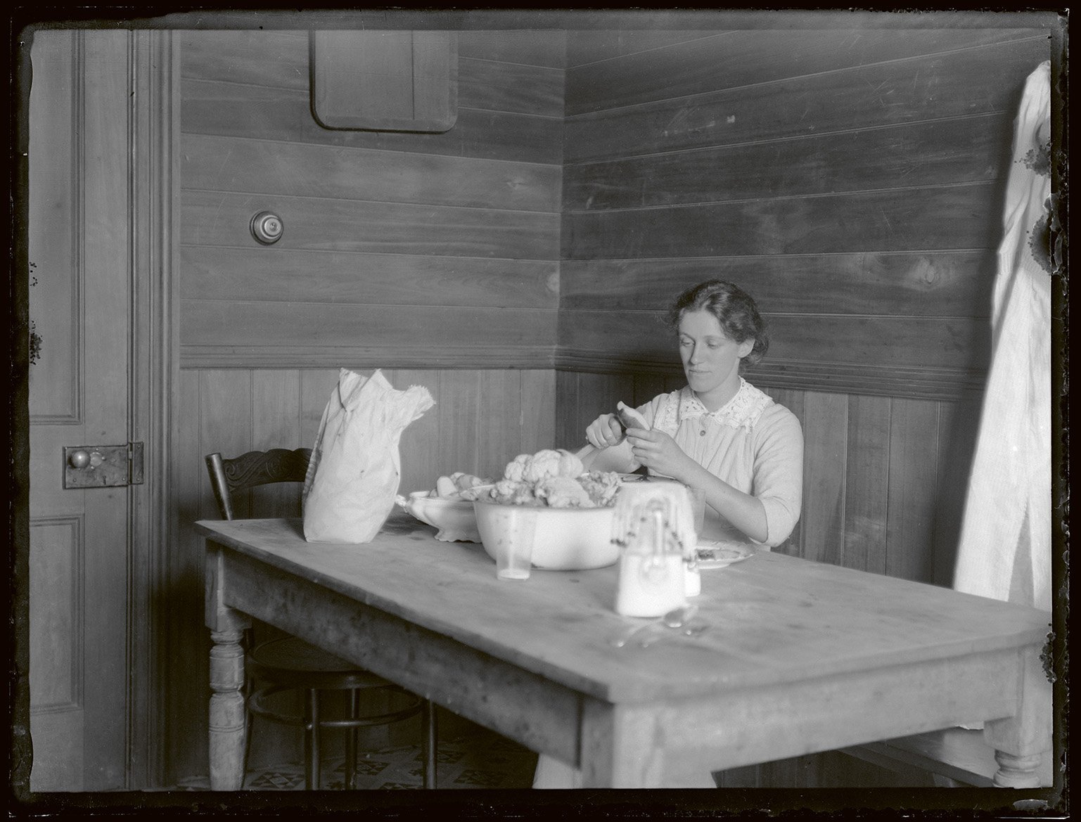 Maud Adkin prepares vegetables, in Hastings, on December 28, 1913. Photo: Leslie Adkin, gift of G...