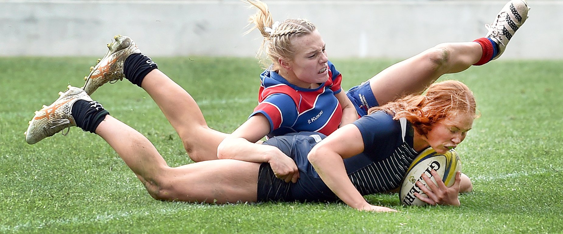 Columba College fullback Pip Eason is tackled by Central Southland College fullback Sophie...