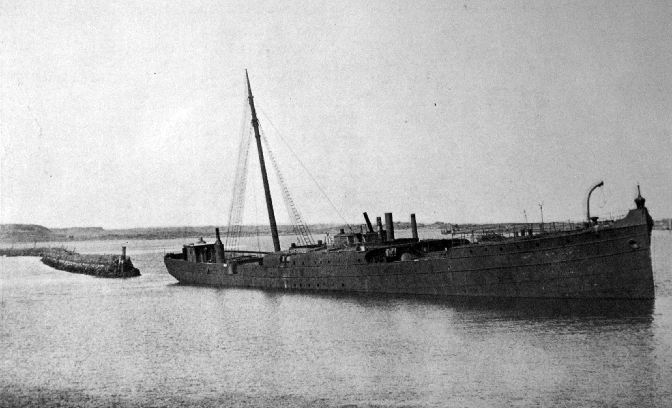 Retired steamship Te Anau rests on the harbour bed at Whanganui, after being towed from Dunedin...