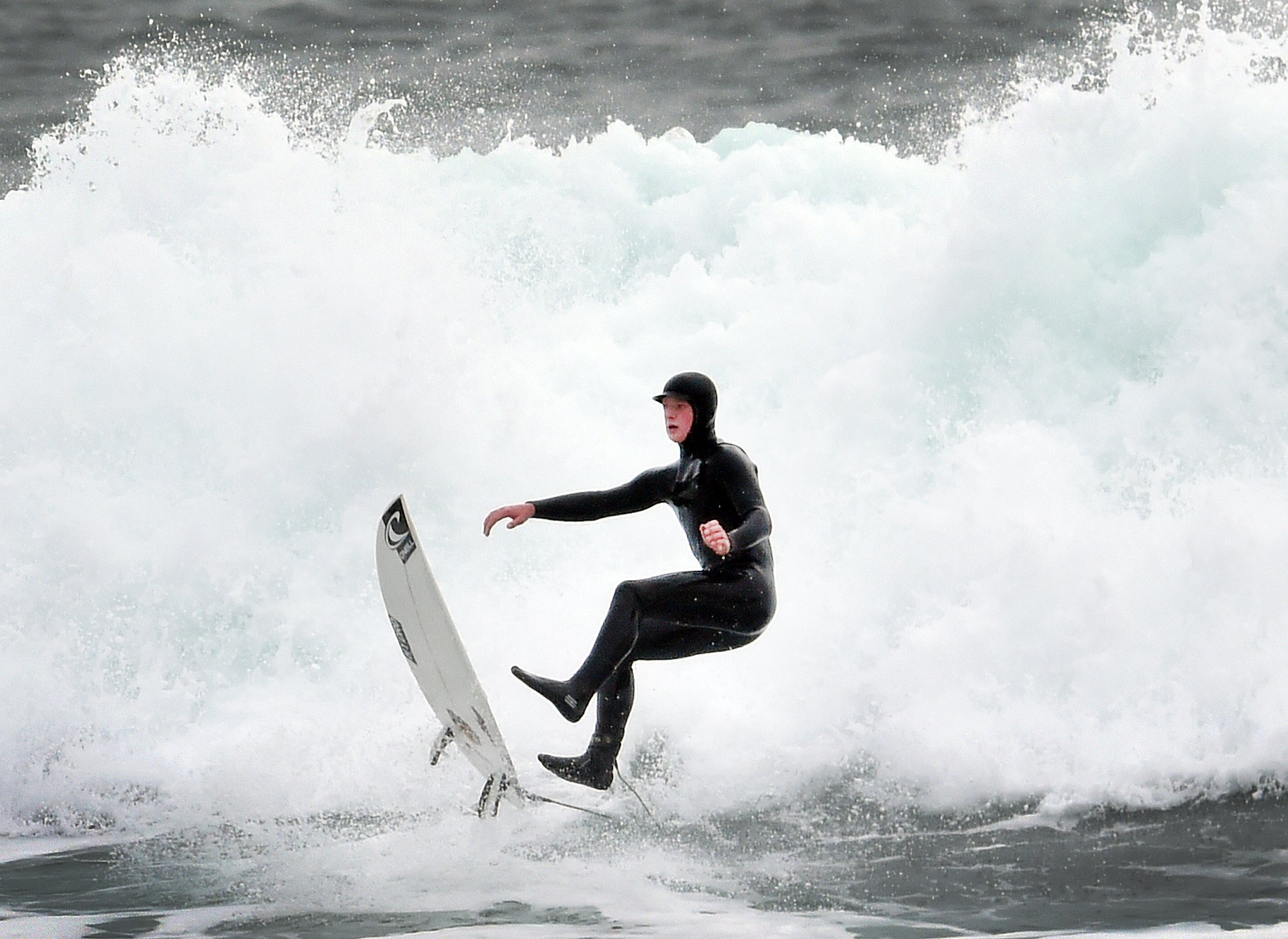 A Dunedin man tries in vain to keep his feet on the board while surfing at St Clair at the...