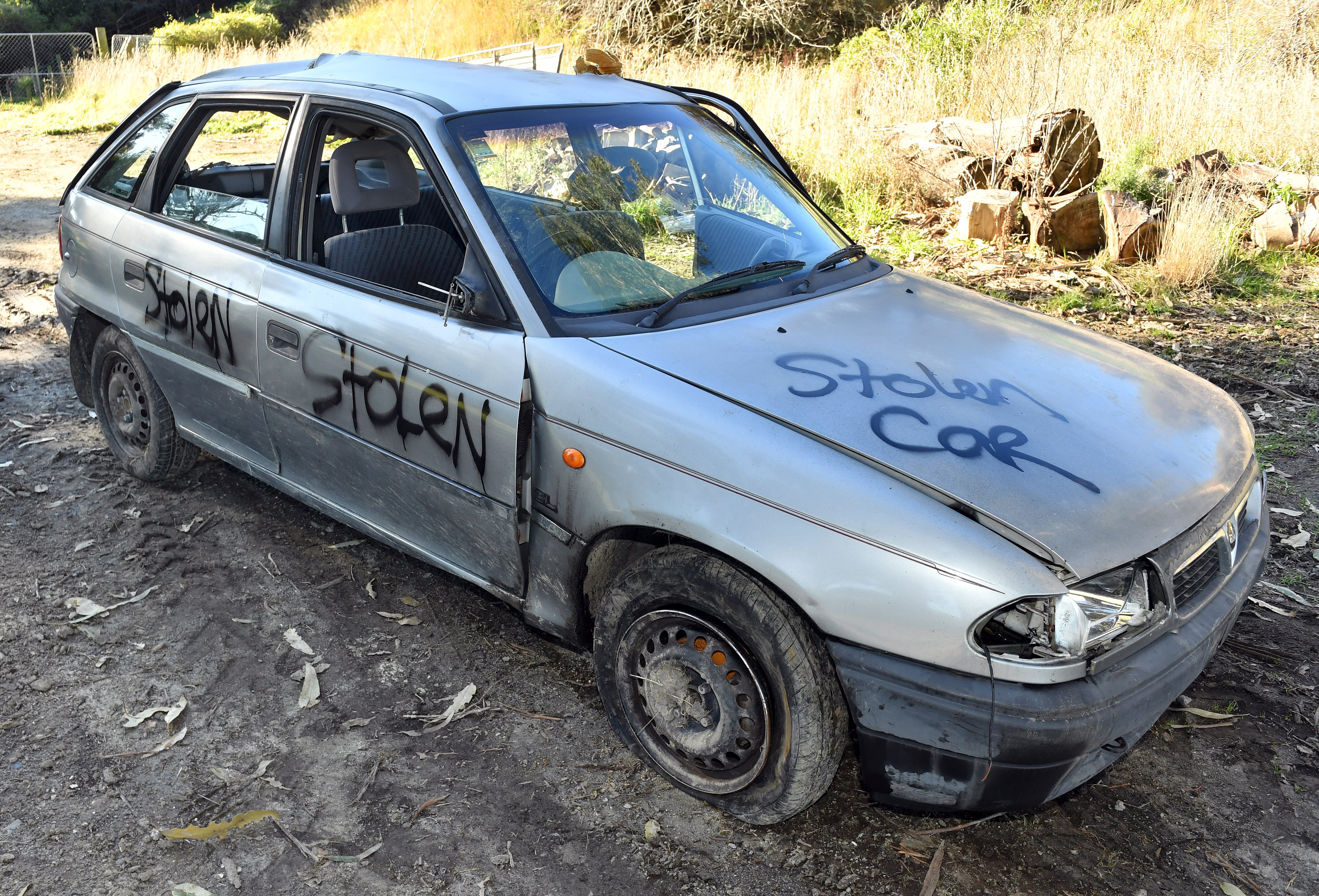 Isaac Tripp’s tagged car was dumped in a paddock in North Taieri. PHOTO: STEPHEN JAQUIERY