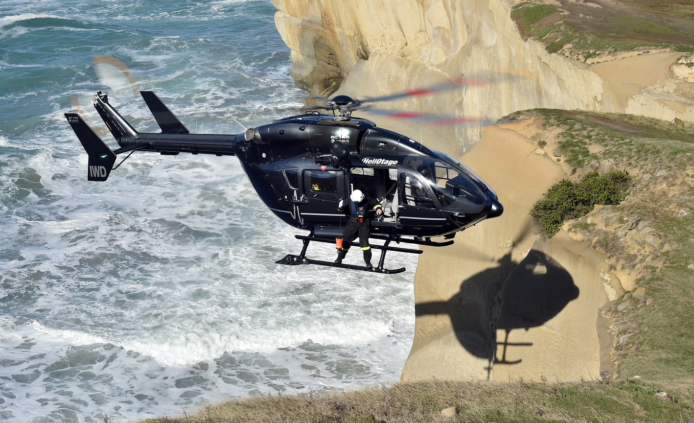 A woman was winched by helicopter from the shore at Tunnel Beach yesterday after three members of...