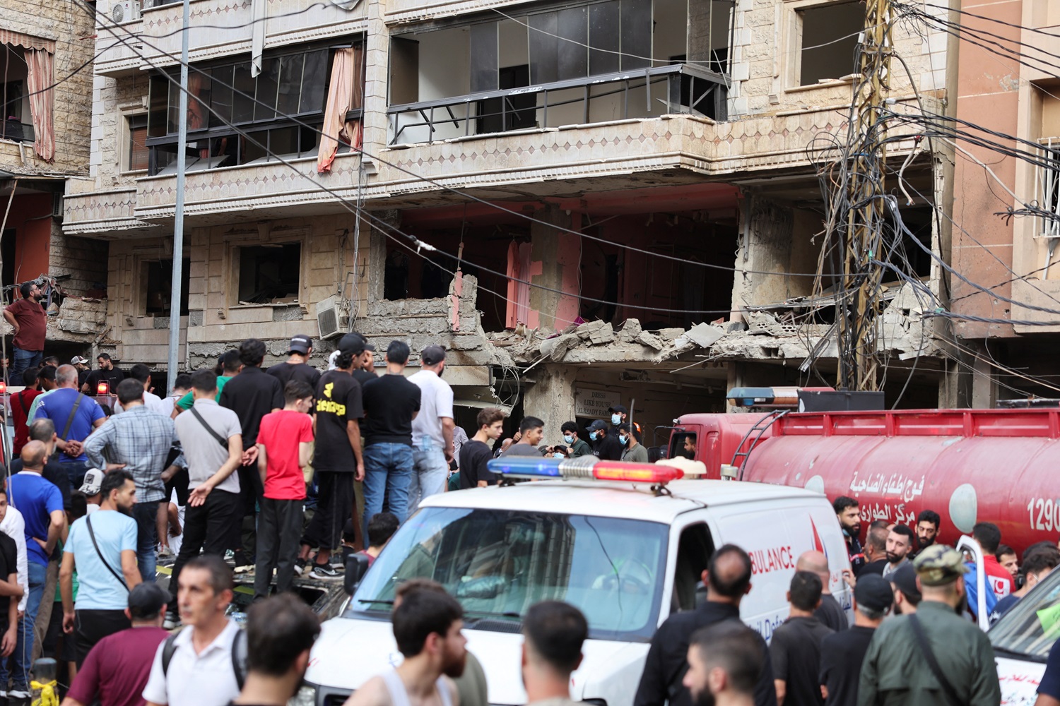 People inspect the site of an Israeli strike in the southern suburbs of Beirut. Photo: Reuters