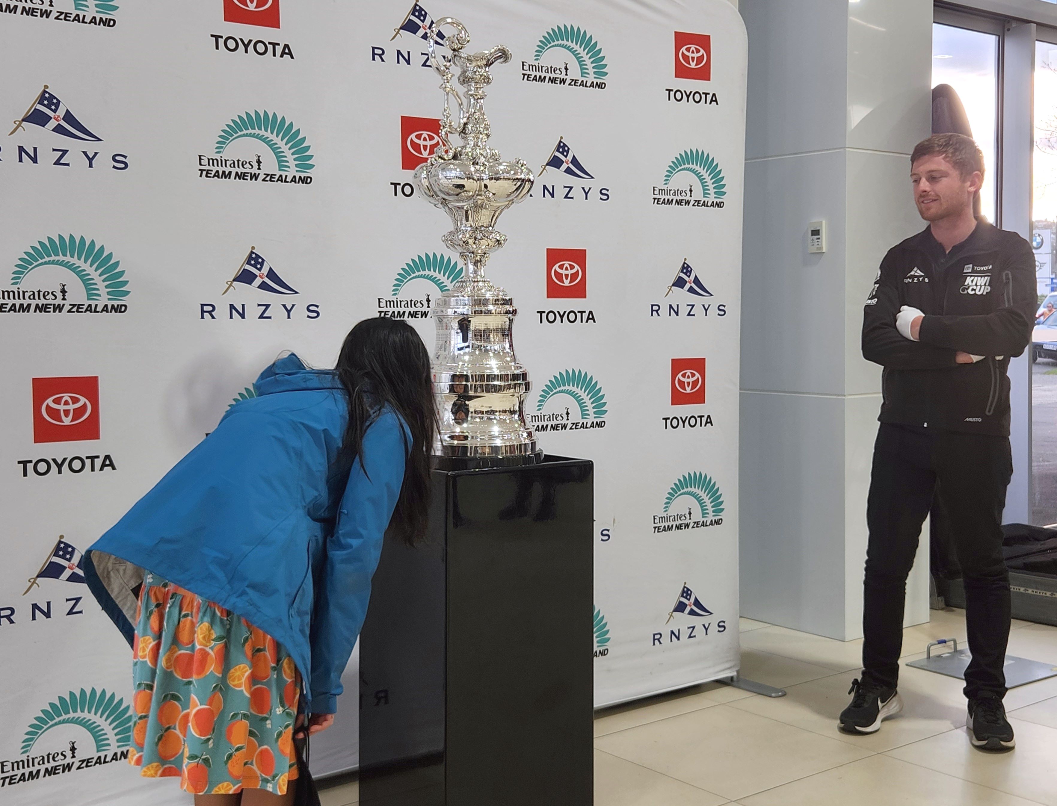 Royal New Zealand Yacht Squadron (RNZYS) cup custodian Cooper Hopman (right) keeps a close eye on...