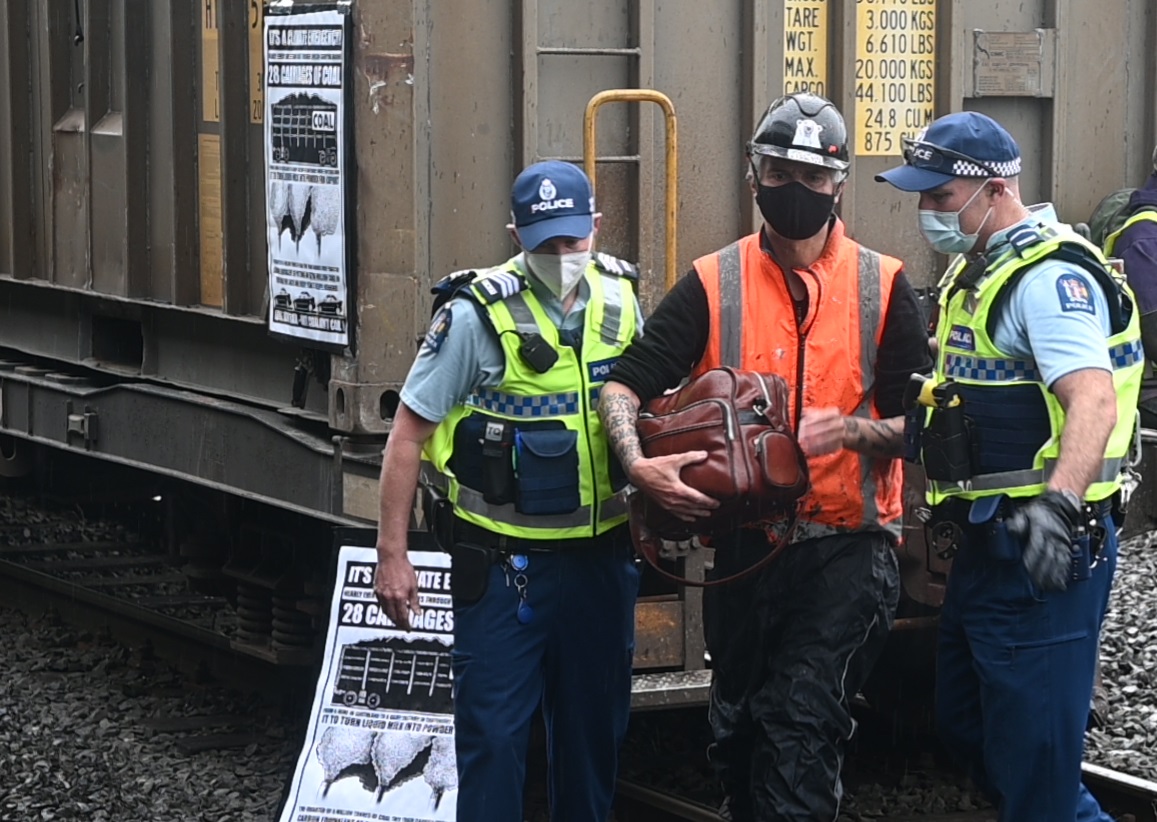 Extinction Rebellion protester Bruce Mahalski is arrested at the Dunedin Railway Station in...