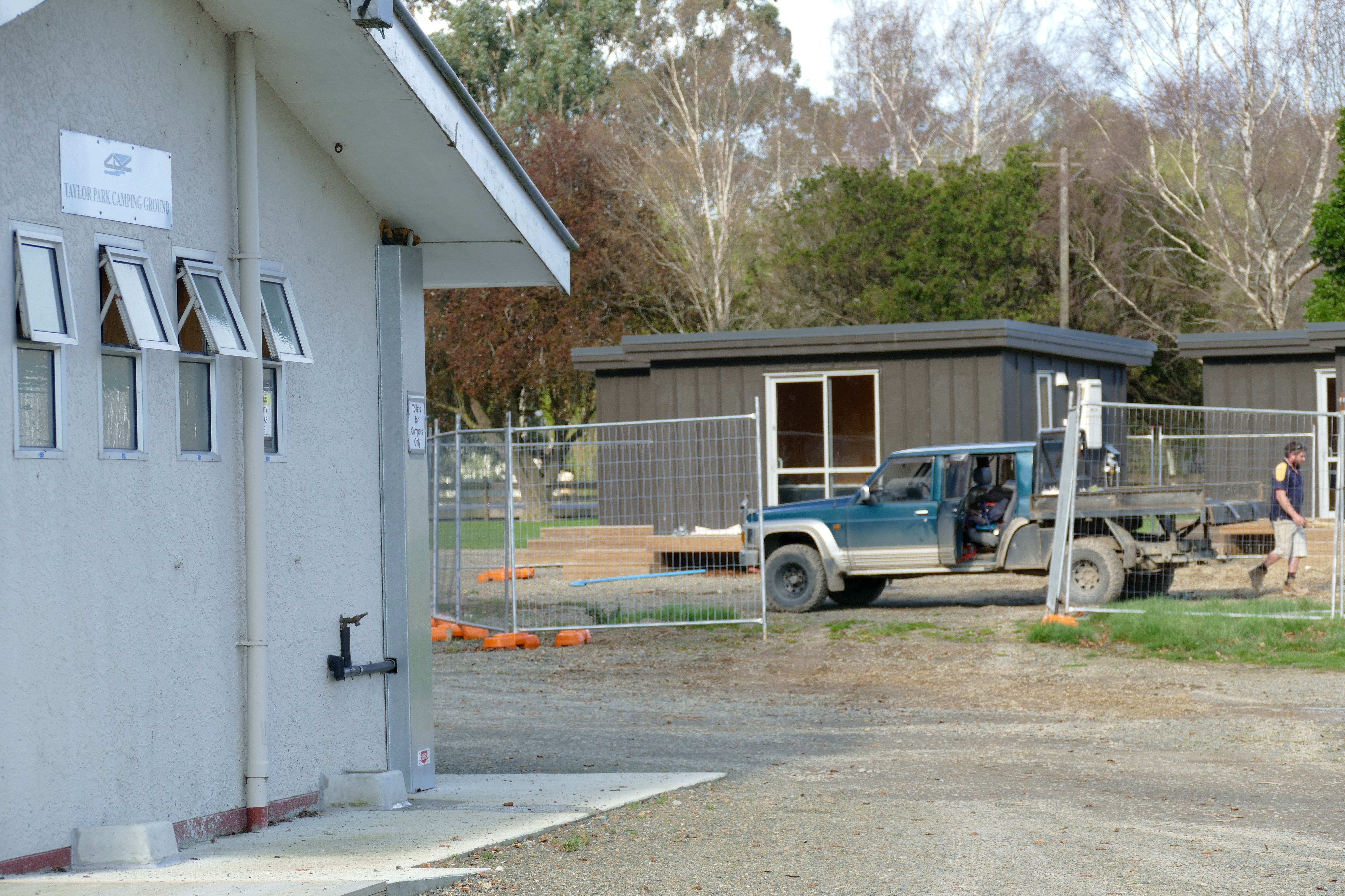 A contractor works on the site of controversial cabins, due to be removed after public outcry, at...