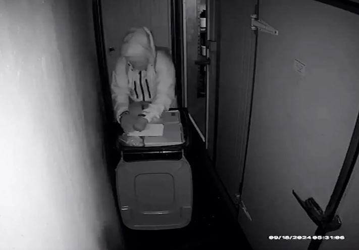 An offender stealing meat from the CBK Craft Bar & Kitchen chiller. Photo: Supplied via Chris...