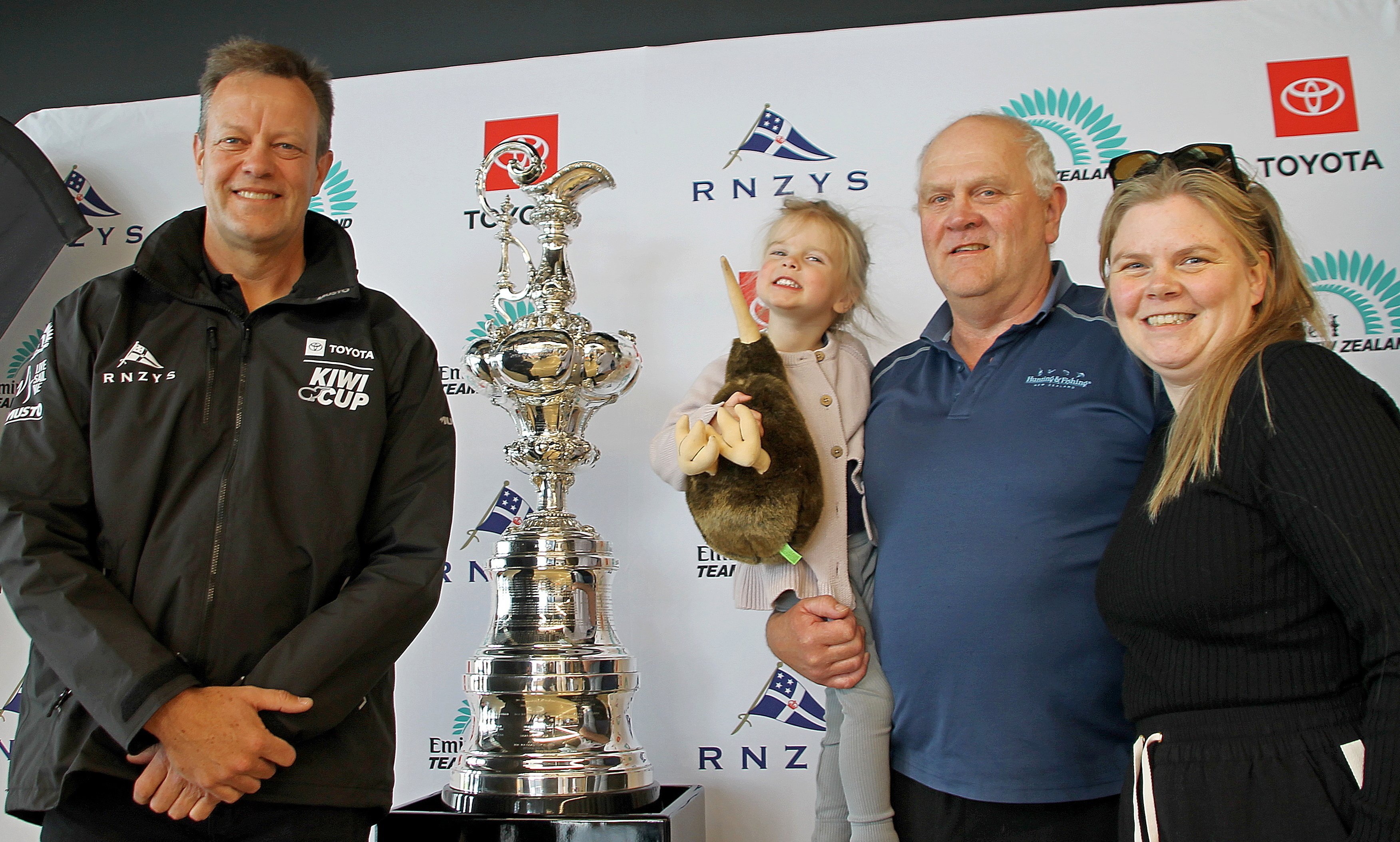 Pour on the charm... Standing by the America’s Cup trophy at TPOMA last Wednesday are (from left)...