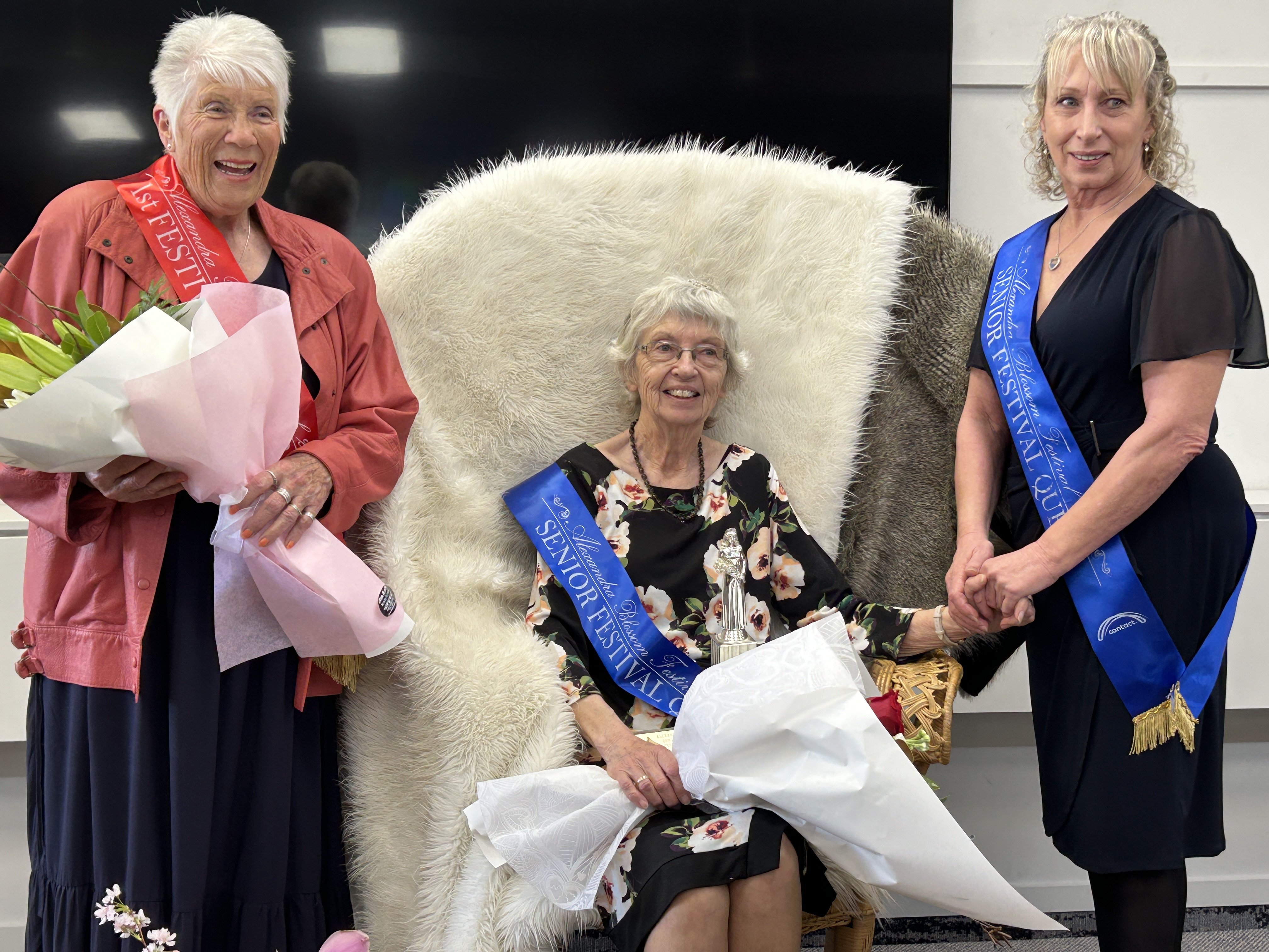 Alexandra Blossom Festival Senior Queen Robyn Marshall, centre, is congratulated by last year’s...