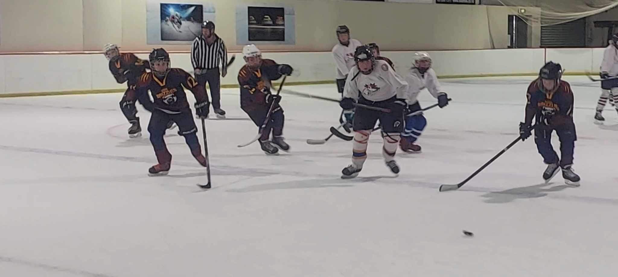 Ice hockey players chase after a puck at the SBS U13 Ice Hockey Tournament held at the Gore Ice...