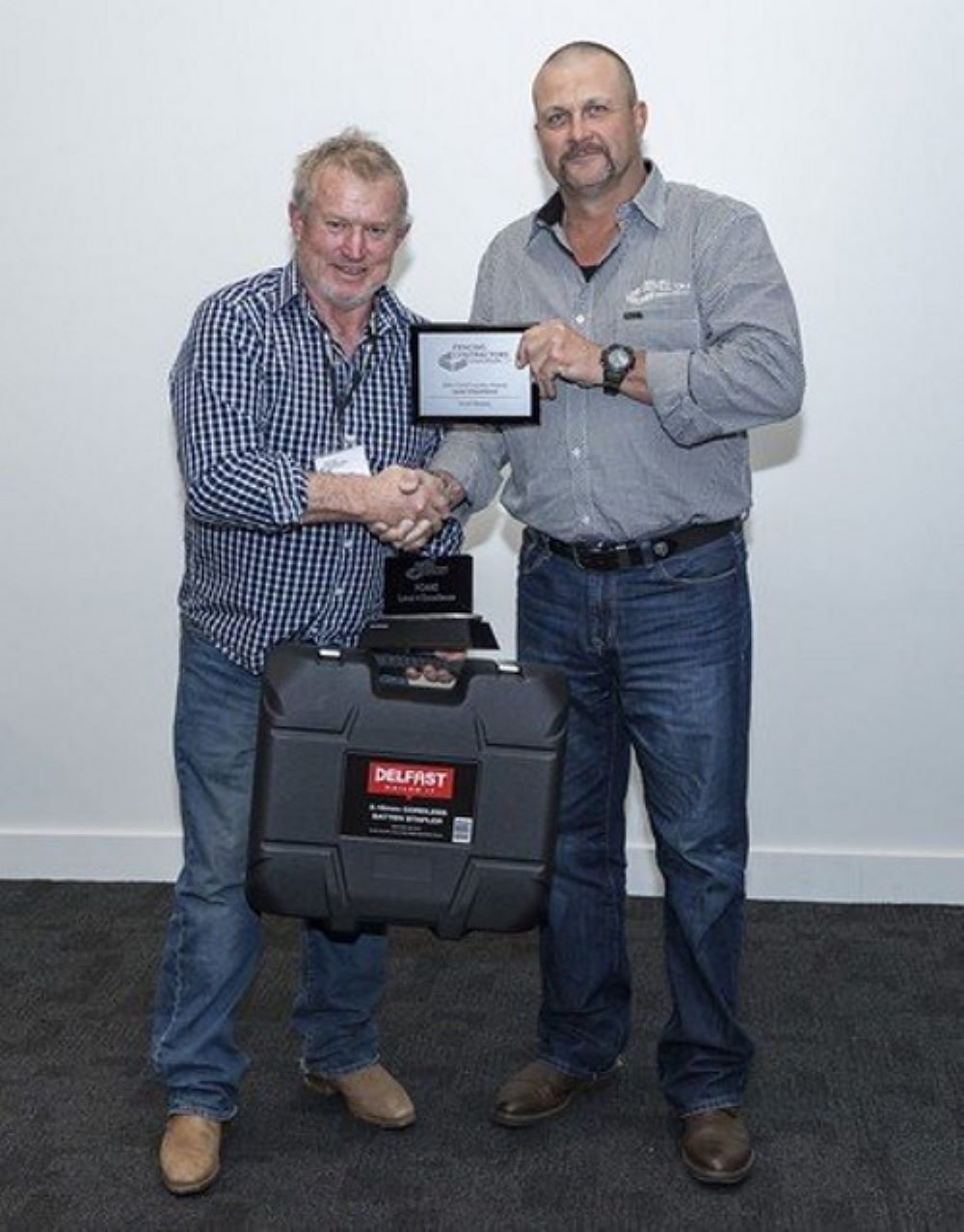 Canterbury fencer Scott Heasley is presented the Level 4 Excellence Award by Fencing Contractors...