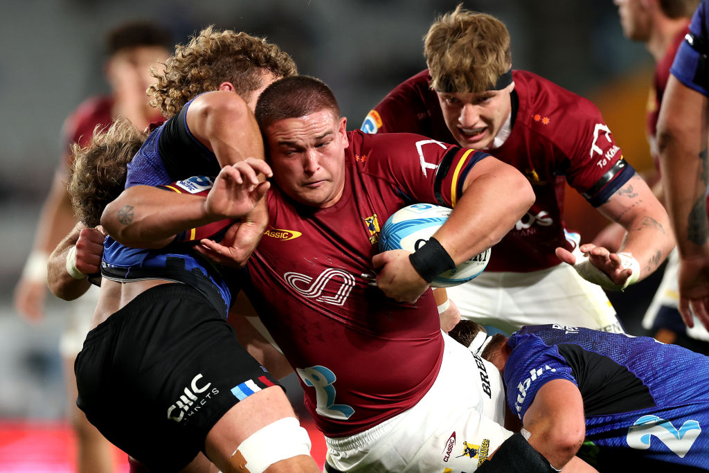 The Highlanders' Ethan De Groot is caught by Blues tacklers during their Super Rugby Pacific...