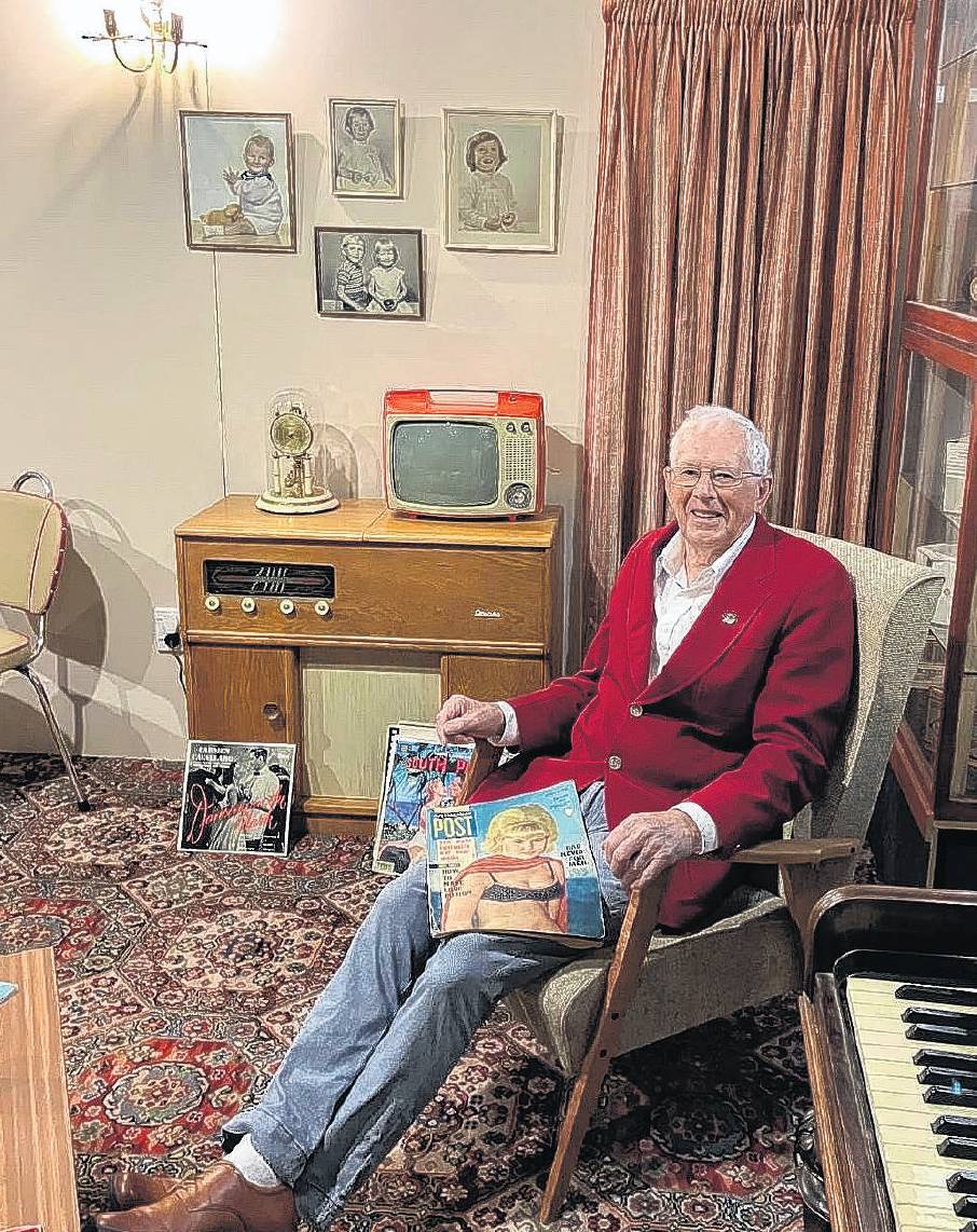 Trevor Stanley relaxes in an armchair in the replica 1960s-70s dining room and lounge he and his...