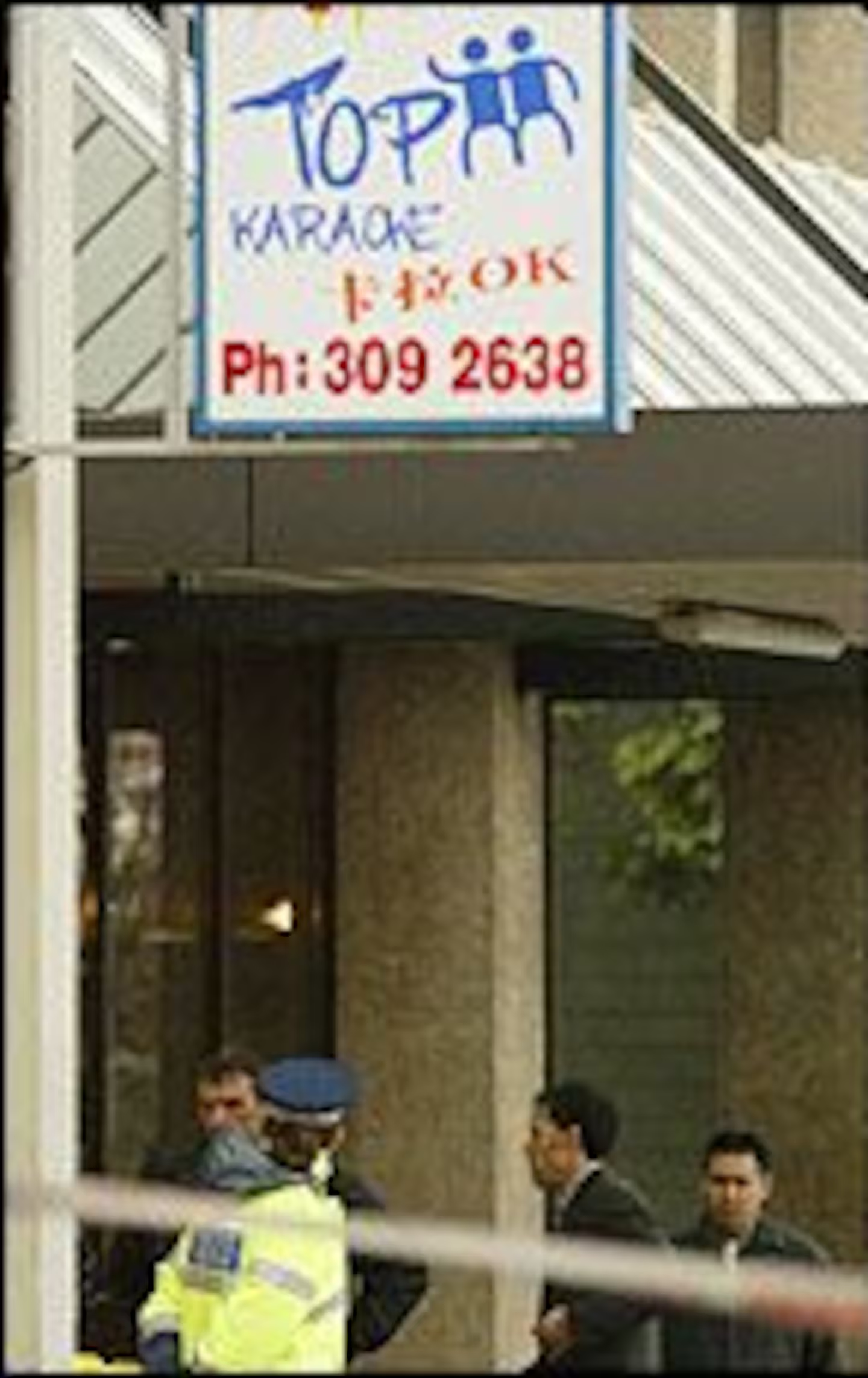 Police on the street side of Top Karaoke Bar on Symonds St where Tam was gunned down. Photo /...