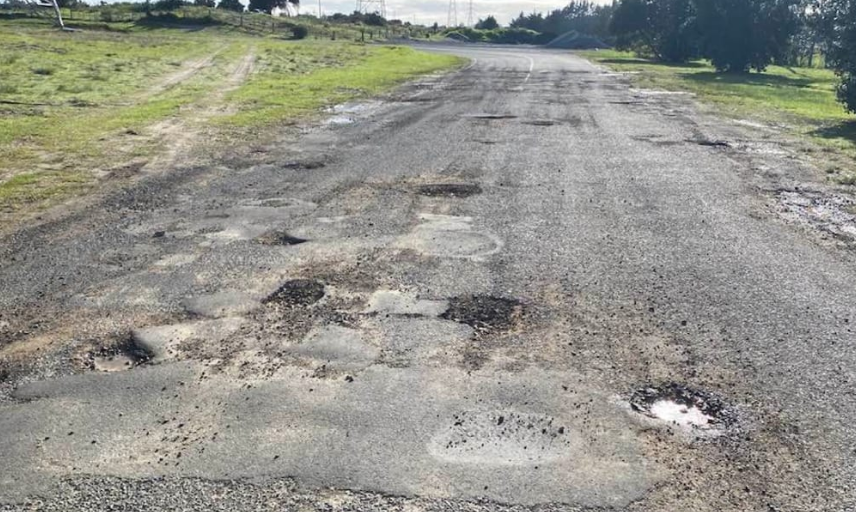 Potholes blight New Zealand's local roads, such as this one in Northland. Photo: Facebook...