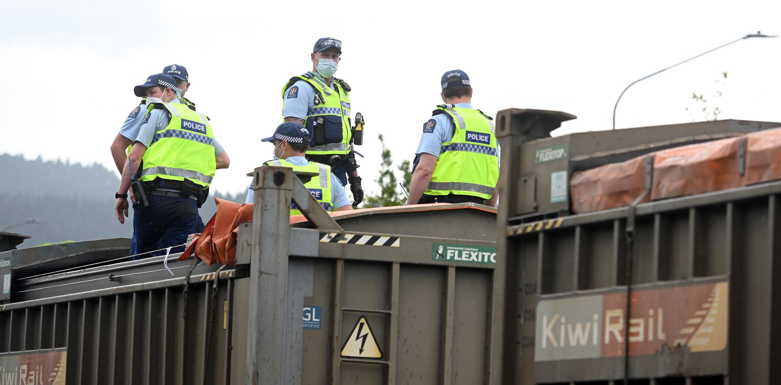 Police atop one of the train’s coal wagons where protesters took up position. Photo: Linda Robertson