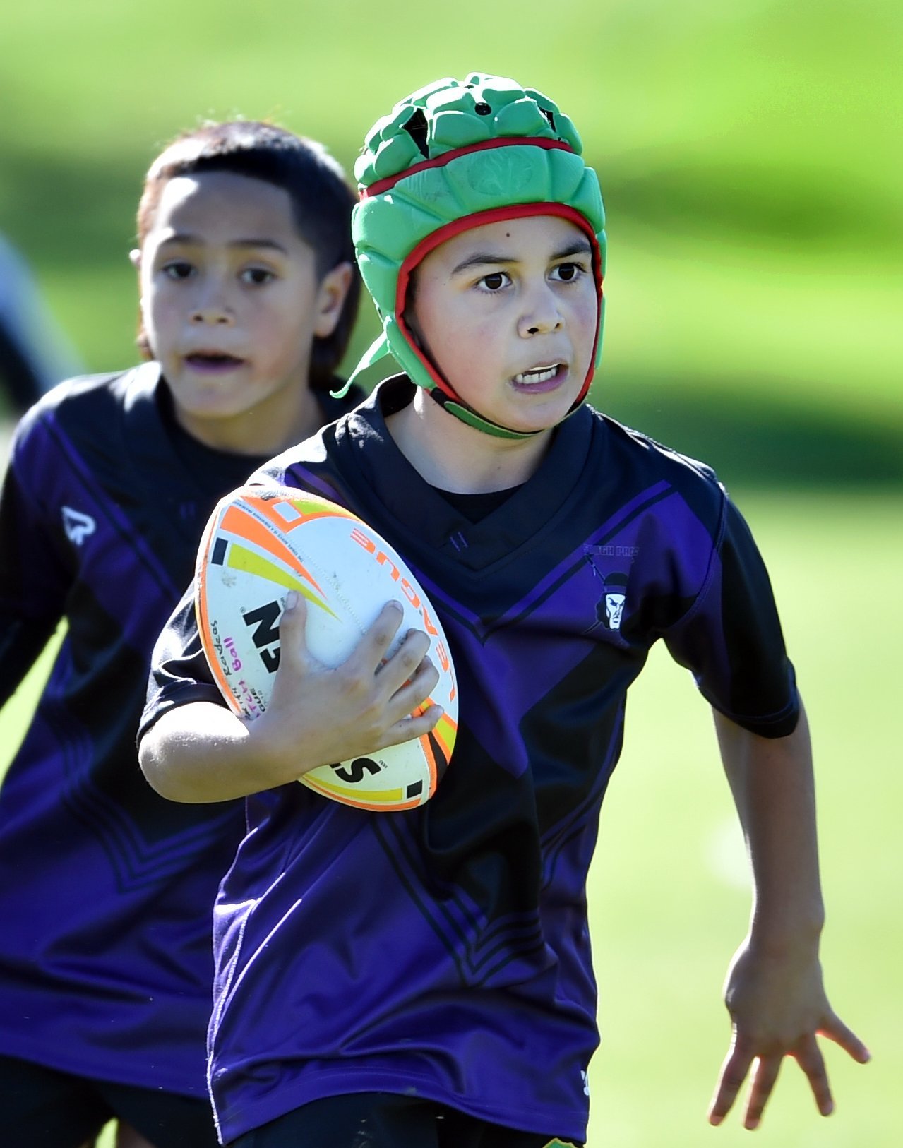 South Pac junior Luka Tiatia, 7, tears off with team-mate Tuhana Nyman-Rakete, 8, in support...