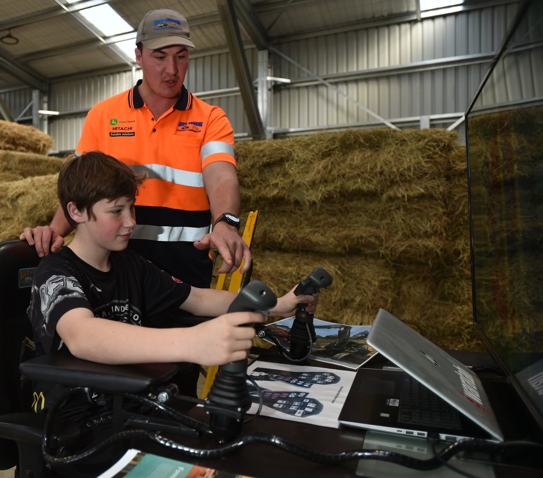 Balclutha’s Mike Hurring Logging and Contracting employee Josh Hurring shows Dunedin school pupil...