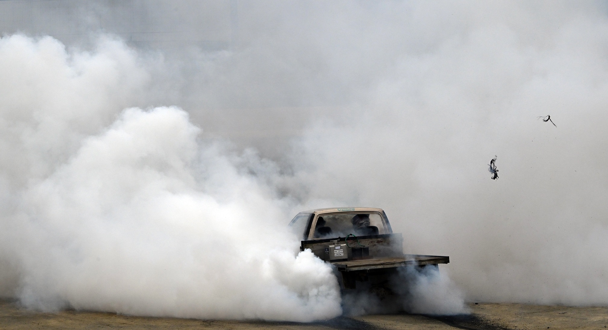 Blowing the rubber from her tyres is Tennille Evans who was first up to show off her burnout...