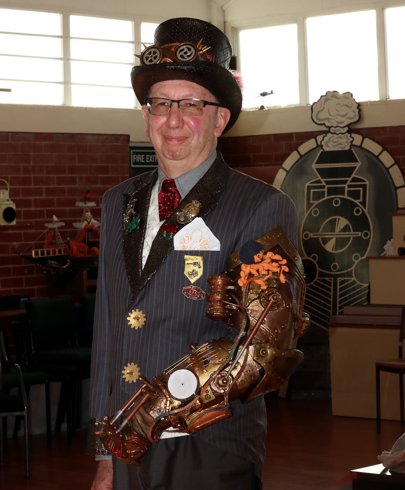 Dunedin Steampunk Society treasurer Allan Benfell shows a robotic arm he created from recycled...