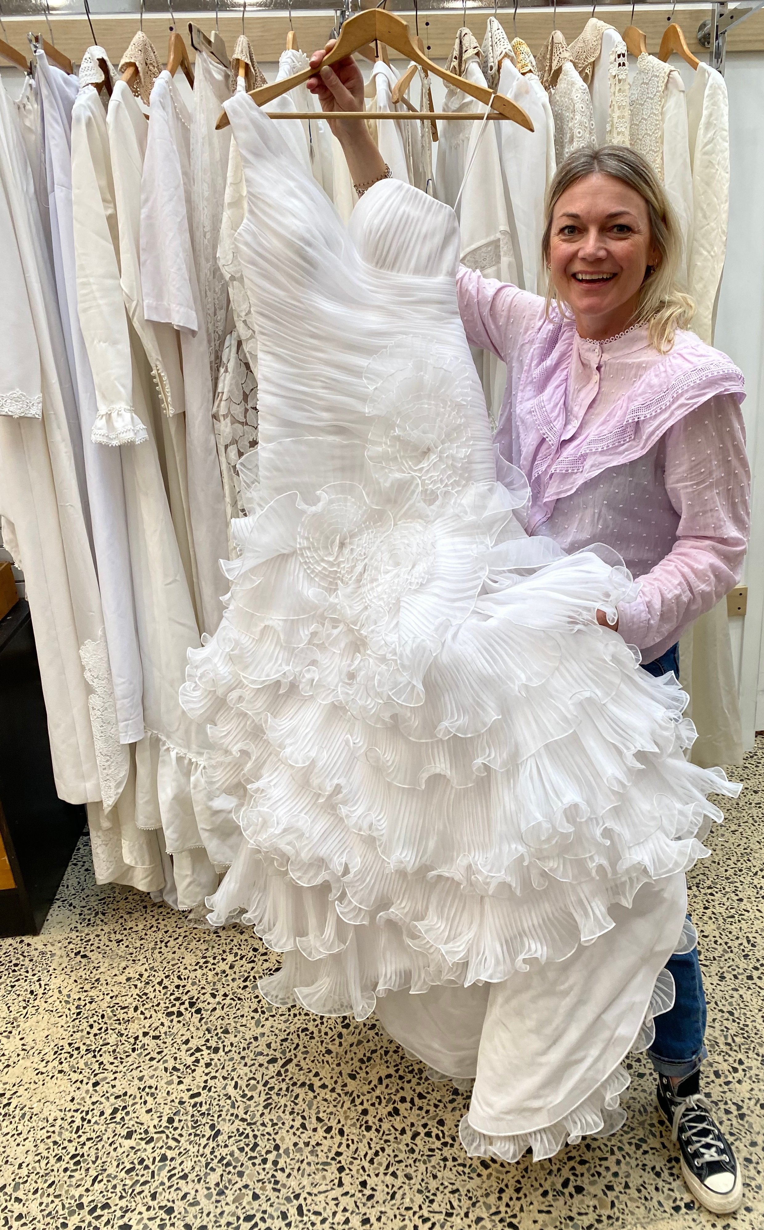 Shop on Carroll co-manager Cristin Waite displays some of the stunning pre-loved wedding dresses...