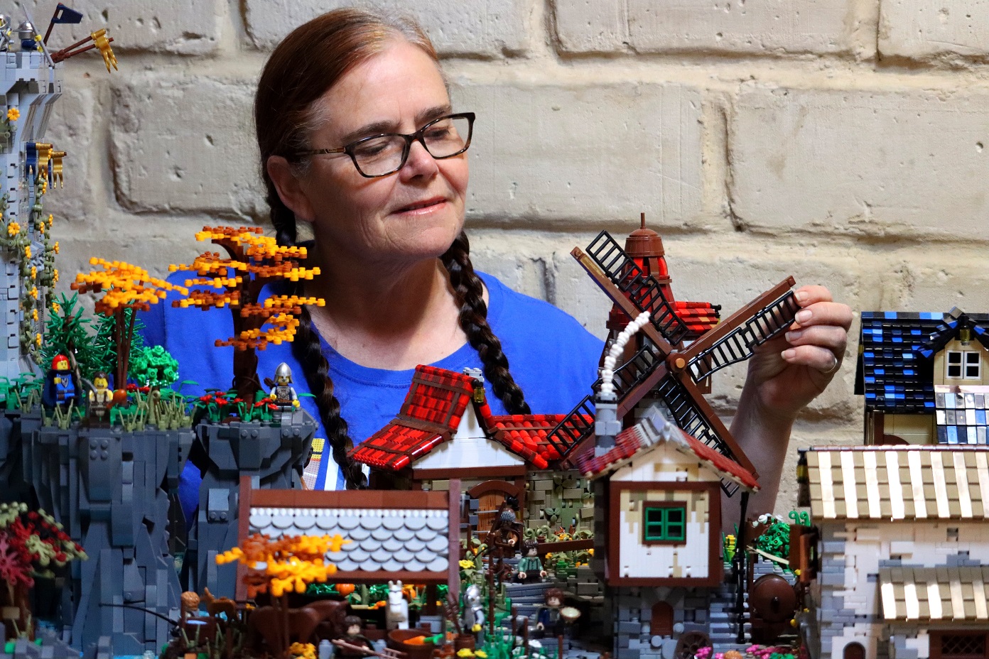 Dunedin Brick Show organiser Jacqui Hay makes an adjustment to a medieval village she will be...