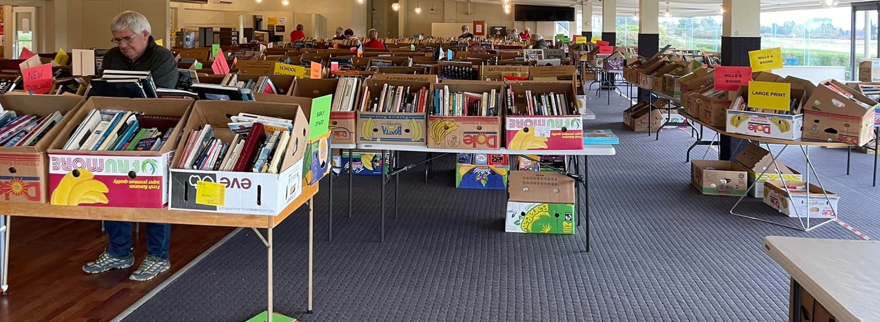 Mosgiel Rotary Club member Warren McLachlan looks through books laid out for last year’s second...