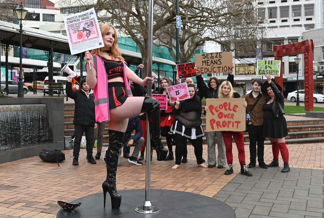 Ex-Stiletto’s stripper Kitten Pasta swings on a pole in the Octagon to protest against conditions...