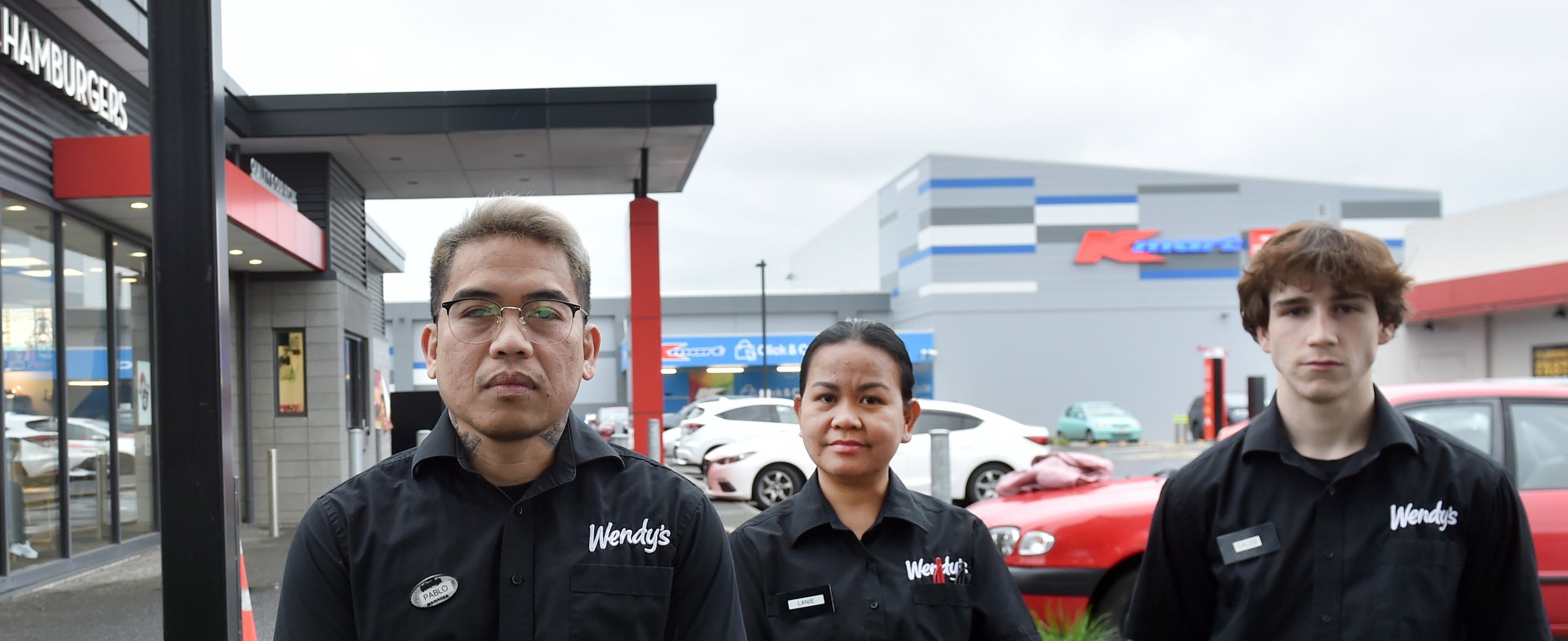 Dunedin Wendy’s Hamburgers general manager Paul Abordonado (left) and staff Lanie Geron and Caleb...