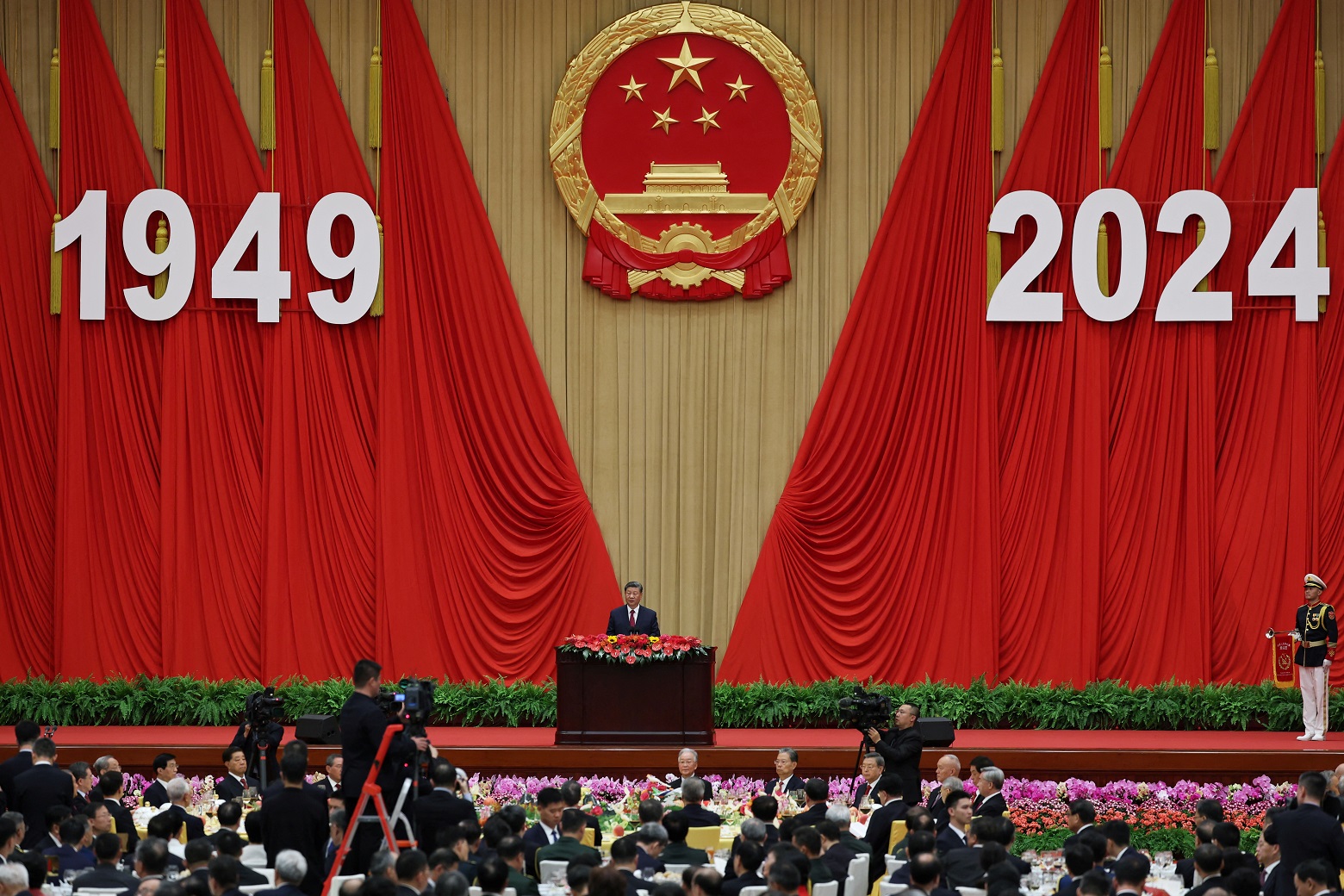 Chinese President Xi Jinping delivers a speech during the National Day reception on the eve of...