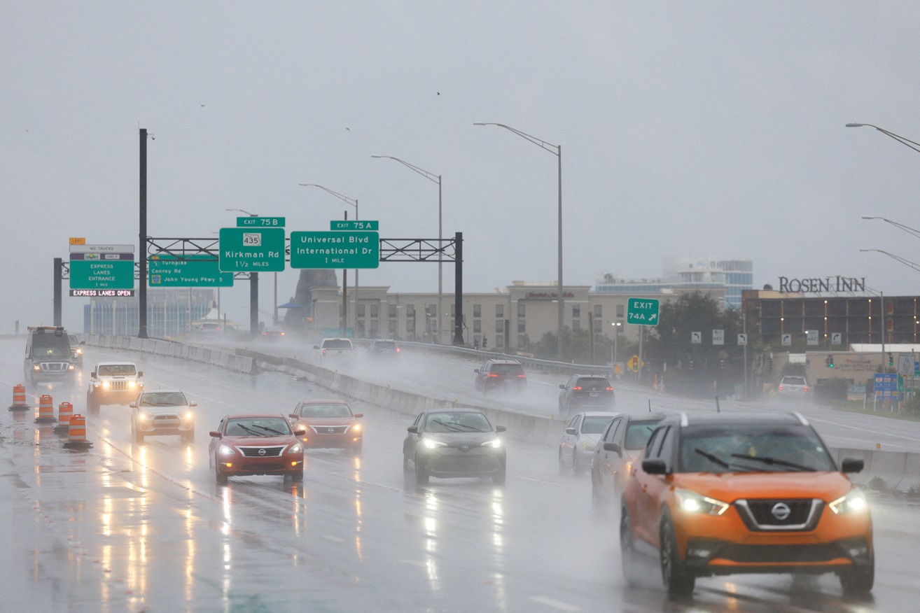 Cars being driven during heavy rainfall as Hurricane Milton approaches Orlando, Florida. Photo:...