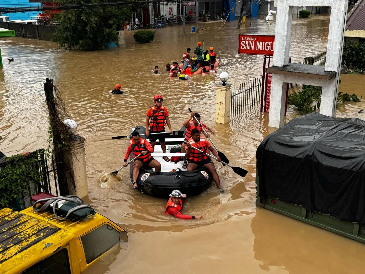 Rescue personnel evacuate residents amid flooding caused by Tropical Storm Trami in Camarines Sur...