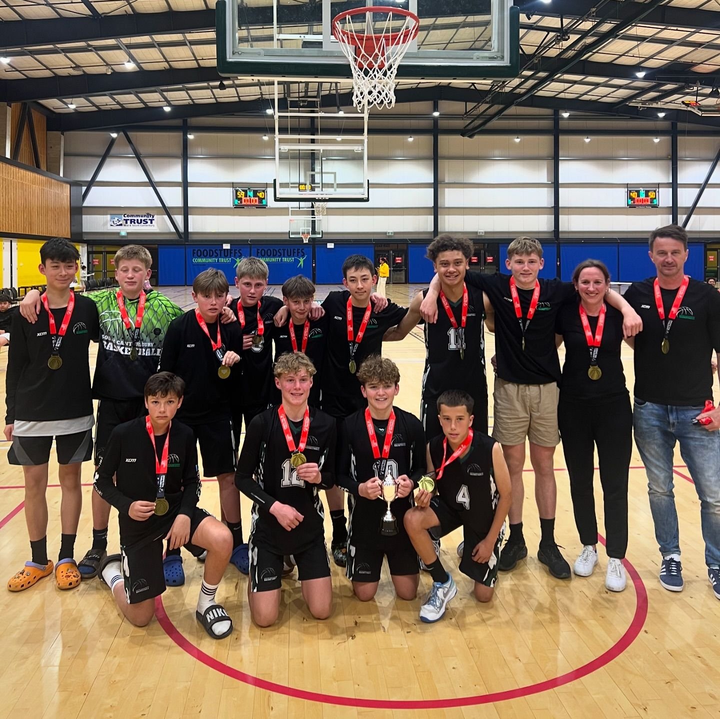 The South Canterbury Black U14 team celebrate winning the Basketball New Zealand Southern...