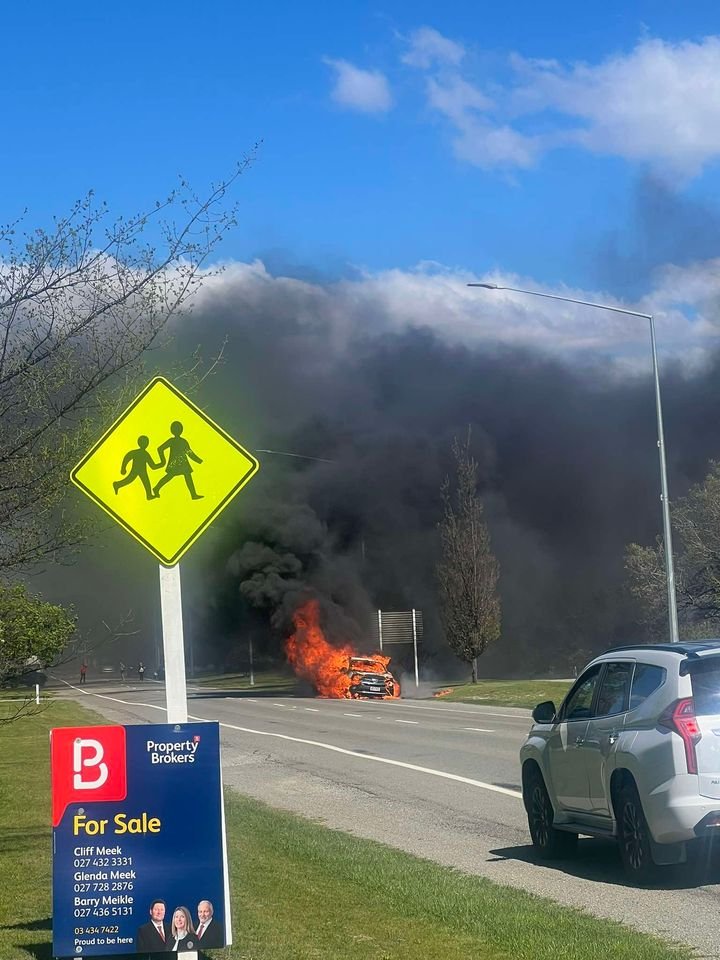 A car billows black smoke on the side of Bledisloe St (State Highway 83) in Kurow yesterday....