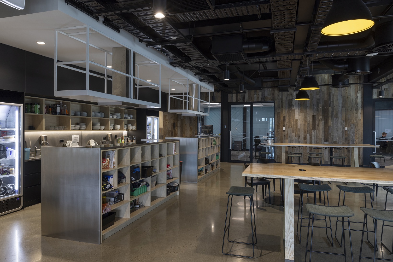 Concrete, steel and timber in the Port Otago staff kitchen reflect the industrial nature of the...