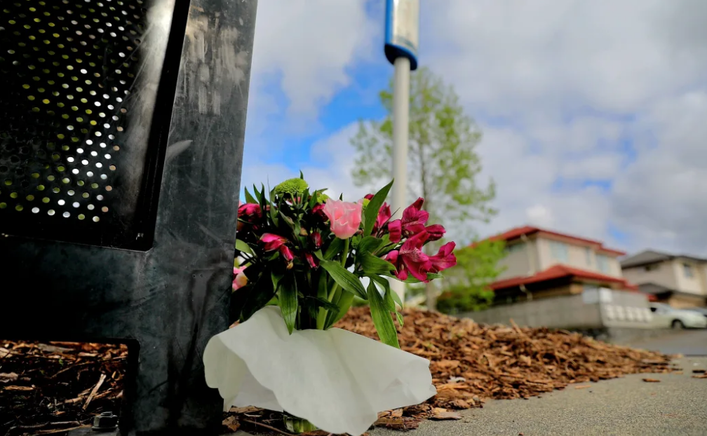 Flowers left at an Onehunga bus stop after a woman was killed on Wednesday. Photo: RNZ