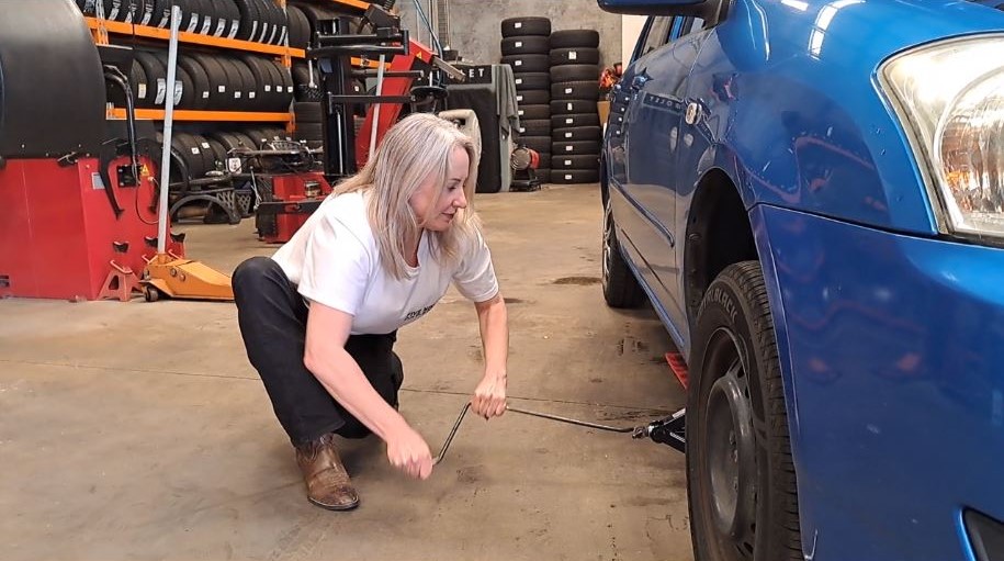 Melissa Hannan demonstrates how to change a tyre, during the weekend workshop aimed at giving...