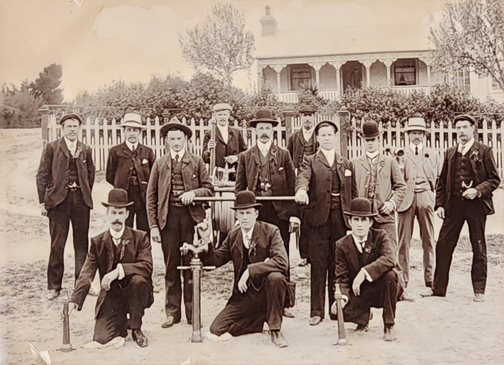 Members of the Cromwell Fire Brigade with fire hose on a handcart in the early days. The crew...