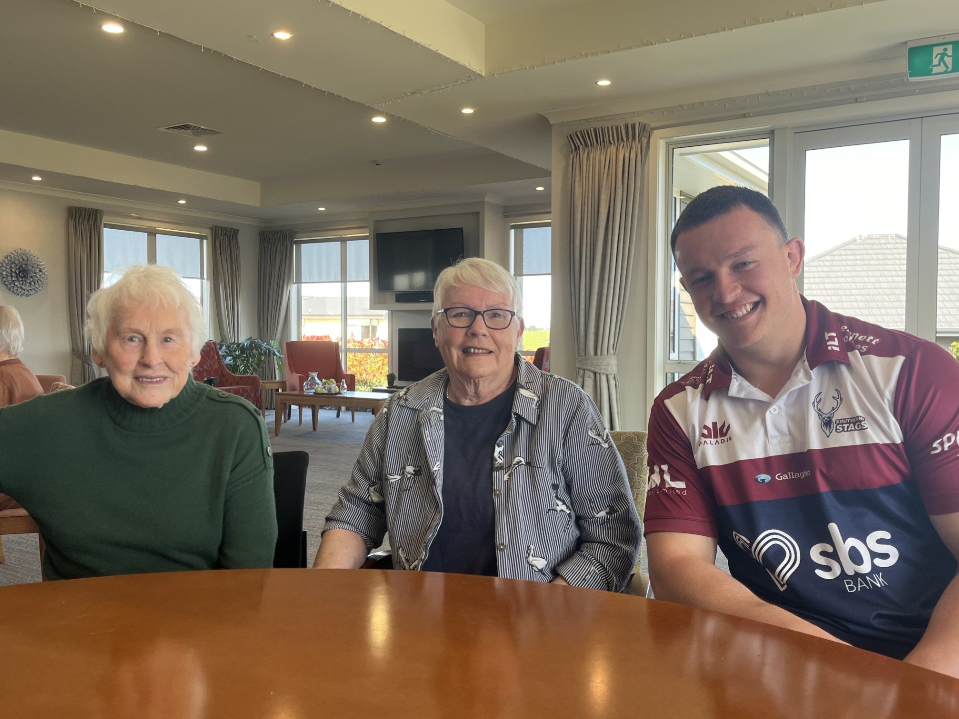 Rugby player Hayden Michaels with his grandmother Helen Affleck and resident Helen Williams....