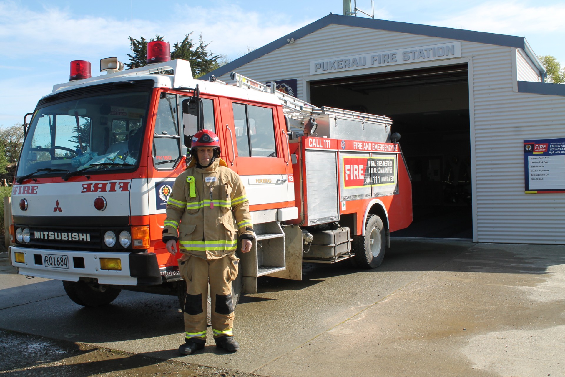 Graham King is receiving his gold star for 25 years of volunteer service for the Pukerau...