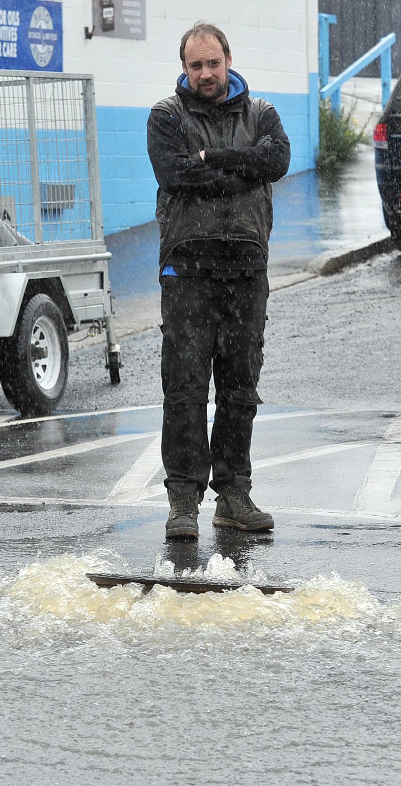 Auto Repair Otago mechanic Aaron Carmichael stares in dismay at an overflowing drain. 