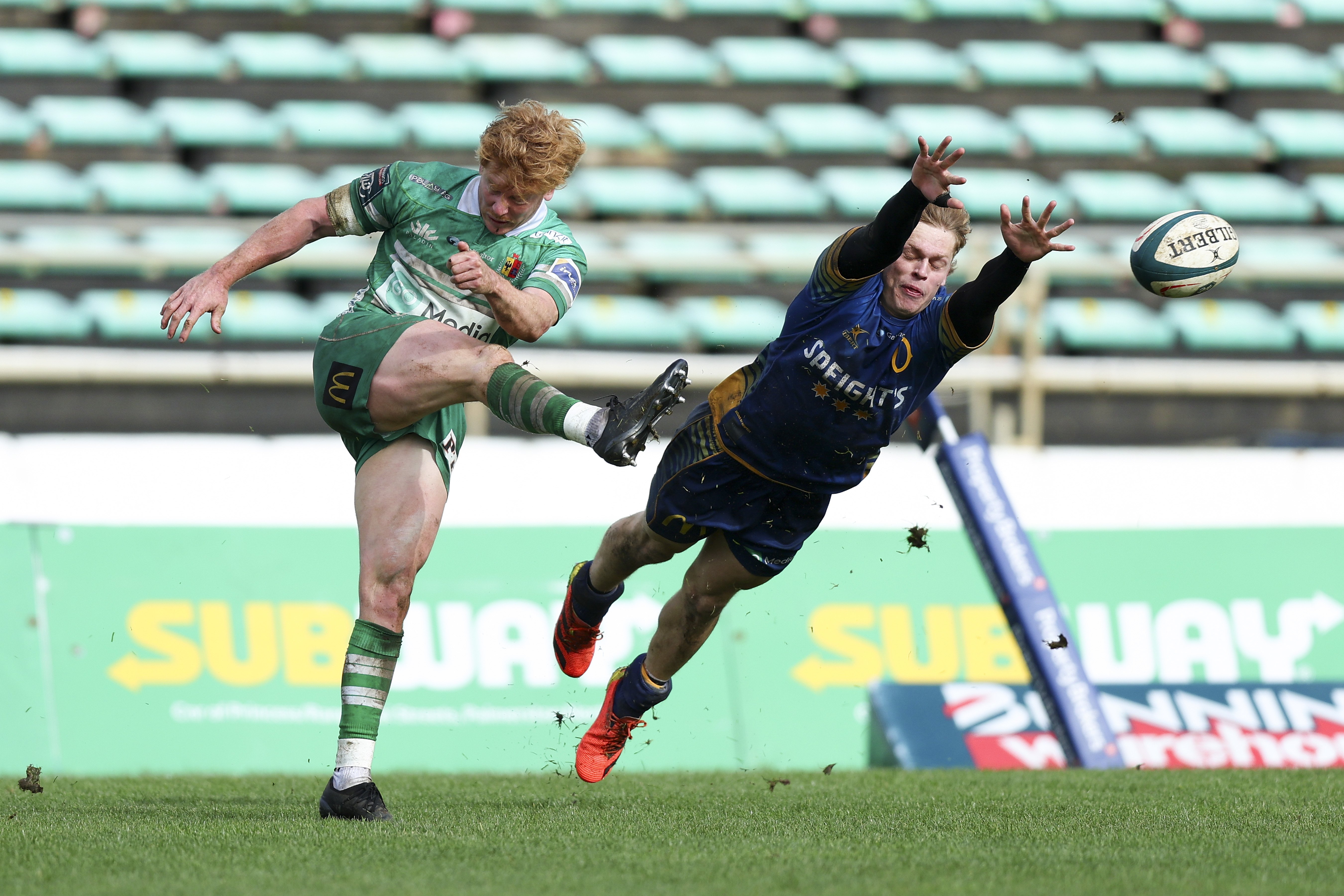 Otago’s Finn Hurley tries his best to block the kick of Reece MacDonald, of Manawatu, during...